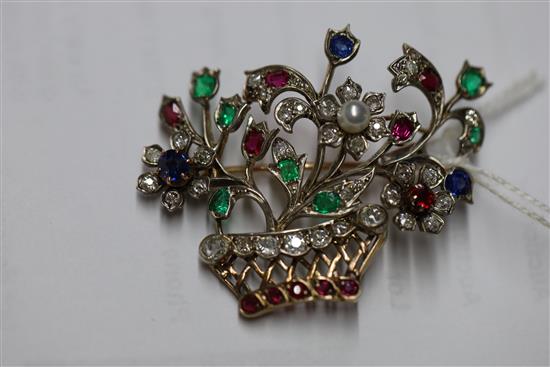An early 20th century gold and multi gem set guiardinetto (flowers in a basket) brooch, gross 9.9 grams.